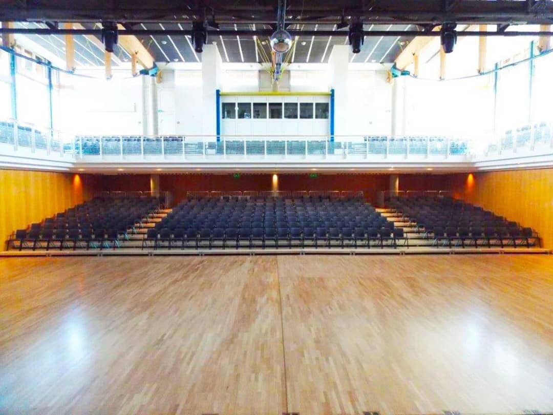 Extended Push'n Pull telescopic grandstand in a sports hall