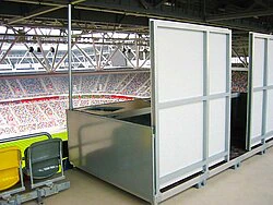 Press cabin with rear wall