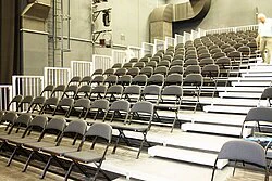 Mobile grandstand with folding chairs