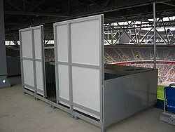 Press cabin with rear wall