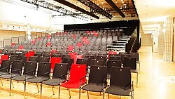 Red & black stacking chairs with numbering